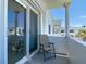 Balcony with sliding door and a chair at 1926 Ocean Shore Blvd # 3120, Ormond Beach, FL 32176