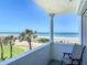Balcony with ocean view, columns, and chair at 1926 Ocean Shore Blvd # 3120, Ormond Beach, FL 32176