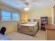 Bedroom with ceiling fan and view of outside buildings at 1926 Ocean Shore Blvd # 3120, Ormond Beach, FL 32176
