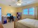Bedroom with ceiling fan, window, desk and storage at 1926 Ocean Shore Blvd # 3120, Ormond Beach, FL 32176