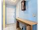 Inviting entryway featuring tiled floors, wooden console table, and decor accents at 1926 Ocean Shore Blvd # 3120, Ormond Beach, FL 32176