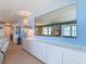 Hallway features built-in storage and a large mirror at 1926 Ocean Shore Blvd # 3120, Ormond Beach, FL 32176