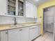 Kitchen features a sink, dishwasher, and ample cabinet storage at 1926 Ocean Shore Blvd # 3120, Ormond Beach, FL 32176