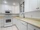 Charming white kitchen featuring updated appliances and plenty of cabinet space at 1926 Ocean Shore Blvd # 3120, Ormond Beach, FL 32176
