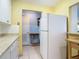 Kitchen leading to breakfast bar and entryway to another room at 1926 Ocean Shore Blvd # 3120, Ormond Beach, FL 32176