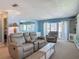 Relaxing living room with comfortable seating, ocean views, and cozy ambiance at 1926 Ocean Shore Blvd # 3120, Ormond Beach, FL 32176