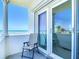 Balcony overlooking the ocean with a chair, ideal for relaxation and enjoying views at 1926 Ocean Shore Blvd # 3120, Ormond Beach, FL 32176