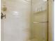 Tile shower with glass door and chrome fixtures at 1926 Ocean Shore Blvd # 3120, Ormond Beach, FL 32176