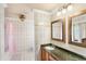 Traditional-style bathroom with tile shower, single sink vanity, and detailed decor at 1994 Excalibur Dr, Orlando, FL 32822