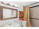 Cozy bathroom with a shower curtain, bright lighting, and modern design at 1994 Excalibur Dr, Orlando, FL 32822