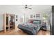 Cozy bedroom with wood floors, ceiling fan, and unique decor and design at 1994 Excalibur Dr, Orlando, FL 32822