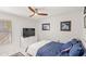 Comfortable bedroom with a ceiling fan, large bed, and a bright and airy atmosphere at 1994 Excalibur Dr, Orlando, FL 32822