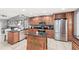 This kitchen features granite countertops, stainless steel appliances, and custom cabinets at 1994 Excalibur Dr, Orlando, FL 32822