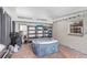 Enclosed patio features a portable hot tub, shelving for storage, and a cozy atmosphere for relaxation at 1994 Excalibur Dr, Orlando, FL 32822