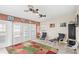 Inviting sitting area with a view to the screened-in pool and a variety of cute dog-themed decor at 1994 Excalibur Dr, Orlando, FL 32822