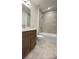 Bathroom with a tub, shower, and a modern single sink vanity at 2013 Stone Wall Ct, Lake Hamilton, FL 33851