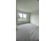 Comfortable bedroom with a large window, plush carpeting, and plenty of natural light at 2013 Stone Wall Ct, Lake Hamilton, FL 33851