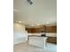 Bright kitchen features a center island, modern appliances, and plenty of cabinet storage at 2013 Stone Wall Ct, Lake Hamilton, FL 33851