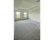 Spacious main bedroom with plush carpeting, ample natural light, and tray ceilings at 2013 Stone Wall Ct, Lake Hamilton, FL 33851