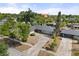 Residential home with mature trees and landscaping, nestled within a well-established neighborhood at 2138 Whitehall Dr, Winter Park, FL 32792
