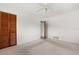 Bright bedroom featuring wood closet doors, ceiling fan, and neutral carpet at 2138 Whitehall Dr, Winter Park, FL 32792