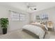 Bright, carpeted bedroom with a ceiling fan, good natural light and a leafy, potted plant at 2138 Whitehall Dr, Winter Park, FL 32792