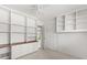 Well-lit bedroom featuring built-in shelving and closet with neutral carpet at 2138 Whitehall Dr, Winter Park, FL 32792