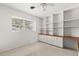 Bedroom with a window, and built-in shelving with a neutral carpet at 2138 Whitehall Dr, Winter Park, FL 32792