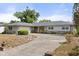 Charming single-story home with a well-maintained lawn and a large, inviting driveway at 2138 Whitehall Dr, Winter Park, FL 32792