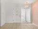 The foyer features tile flooring, a stylish front door and contemporary lighting at 2138 Whitehall Dr, Winter Park, FL 32792