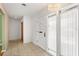 The bright foyer features tile flooring and a modern chandelier at 2138 Whitehall Dr, Winter Park, FL 32792