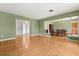 Inviting living space with hardwood floors, seamlessly connecting to the dining and kitchen areas at 2138 Whitehall Dr, Winter Park, FL 32792