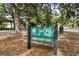 Close-up of a Cady Way Park sign with a picnic shelter in the background at 2138 Whitehall Dr, Winter Park, FL 32792