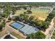 Aerial view of tennis and pickleball courts surrounded by lush greenery and recreational facilities at 2138 Whitehall Dr, Winter Park, FL 32792