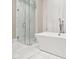 Modern bathroom with a glass-enclosed shower and a luxurious soaking tub at 220 S Summerlin Ave, Orlando, FL 32801