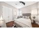 A stylish bedroom featuring hardwood floors, and a ceiling fan at 220 S Summerlin Ave, Orlando, FL 32801