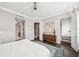 Bright bedroom with a view of the bathroom, walk-in closet, and wooden accents at 220 S Summerlin Ave, Orlando, FL 32801