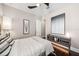 Well-appointed bedroom with stylish decor, hardwood floors, and a modern ceiling fan at 220 S Summerlin Ave, Orlando, FL 32801