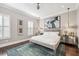 Serene bedroom featuring a comfortable bed, stylish decor, and ample natural light at 220 S Summerlin Ave, Orlando, FL 32801