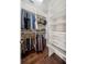 Organized walk-in closet with custom shelving and ample storage space for clothing and accessories at 220 S Summerlin Ave, Orlando, FL 32801