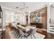 Elegant dining room featuring a marble table, modern lighting, and sophisticated decor at 220 S Summerlin Ave, Orlando, FL 32801