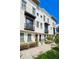 Elegant three-story townhome features classic architectural details and meticulously maintained landscaping at 220 S Summerlin Ave, Orlando, FL 32801