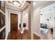 Inviting foyer with hardwood floors, decorative columns, and an open view into the living area at 220 S Summerlin Ave, Orlando, FL 32801