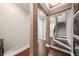 Stylish foyer featuring hardwood floors, leading to a staircase with dark wood treads and white risers at 220 S Summerlin Ave, Orlando, FL 32801