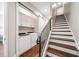 Hallway featuring hardwood floors and modern laundry closet at 220 S Summerlin Ave, Orlando, FL 32801