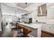 Open-concept kitchen featuring a large island, stainless steel appliances, and a seamless flow to living areas at 220 S Summerlin Ave, Orlando, FL 32801