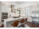 Well-appointed kitchen with a center island, modern stainless-steel appliances, and stylish barstool seating at 220 S Summerlin Ave, Orlando, FL 32801