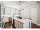 Bright kitchen featuring a central island, stainless steel appliances, and ample cabinet space at 220 S Summerlin Ave, Orlando, FL 32801