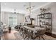 Open-concept living and dining area featuring elegant decor and hardwood floors at 220 S Summerlin Ave, Orlando, FL 32801