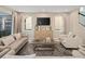 Inviting living room featuring a large media center and neutral decor at 2332 Salty Winds Way, Kissimmee, FL 34747